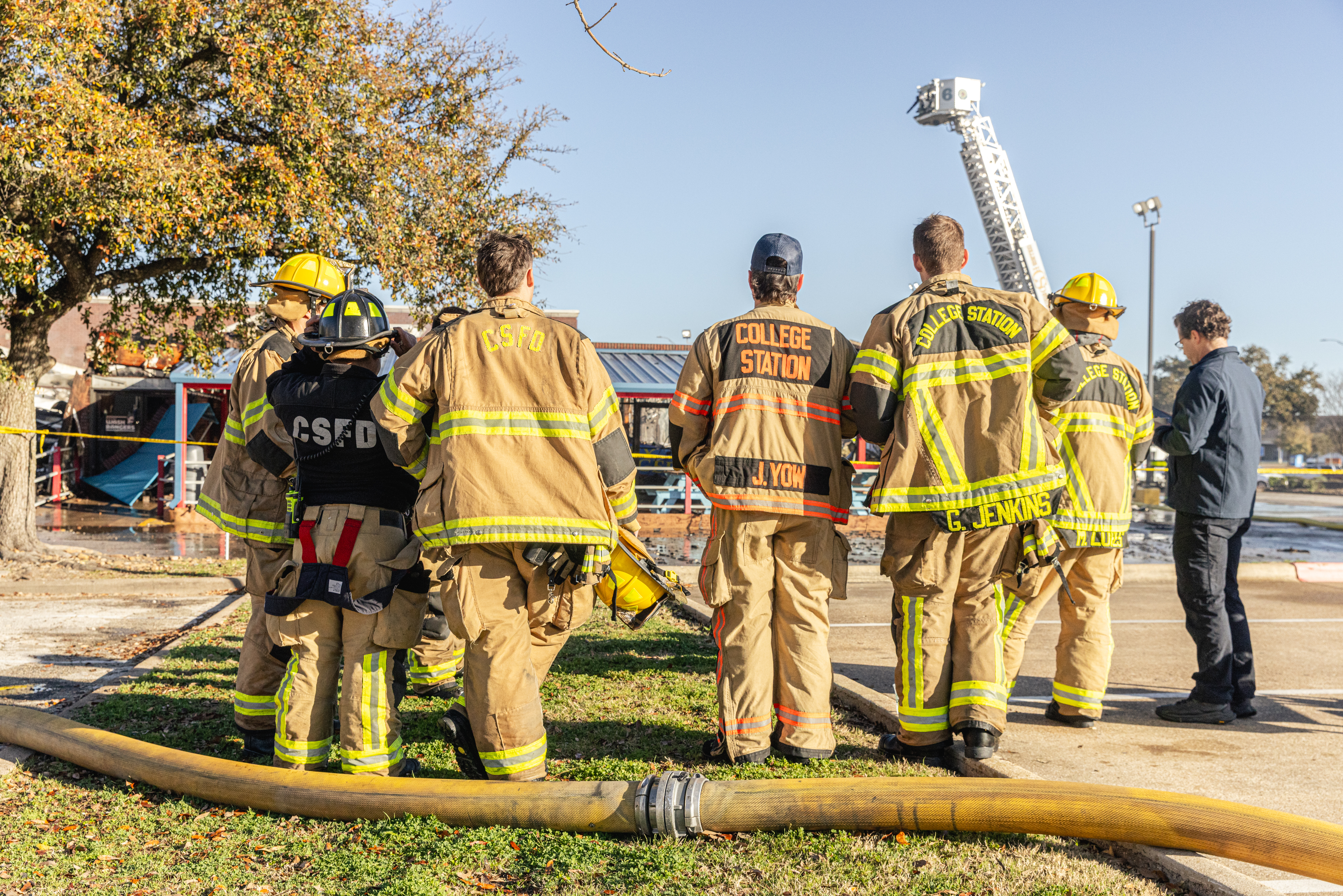 Back of Firefighters Jackets as they work