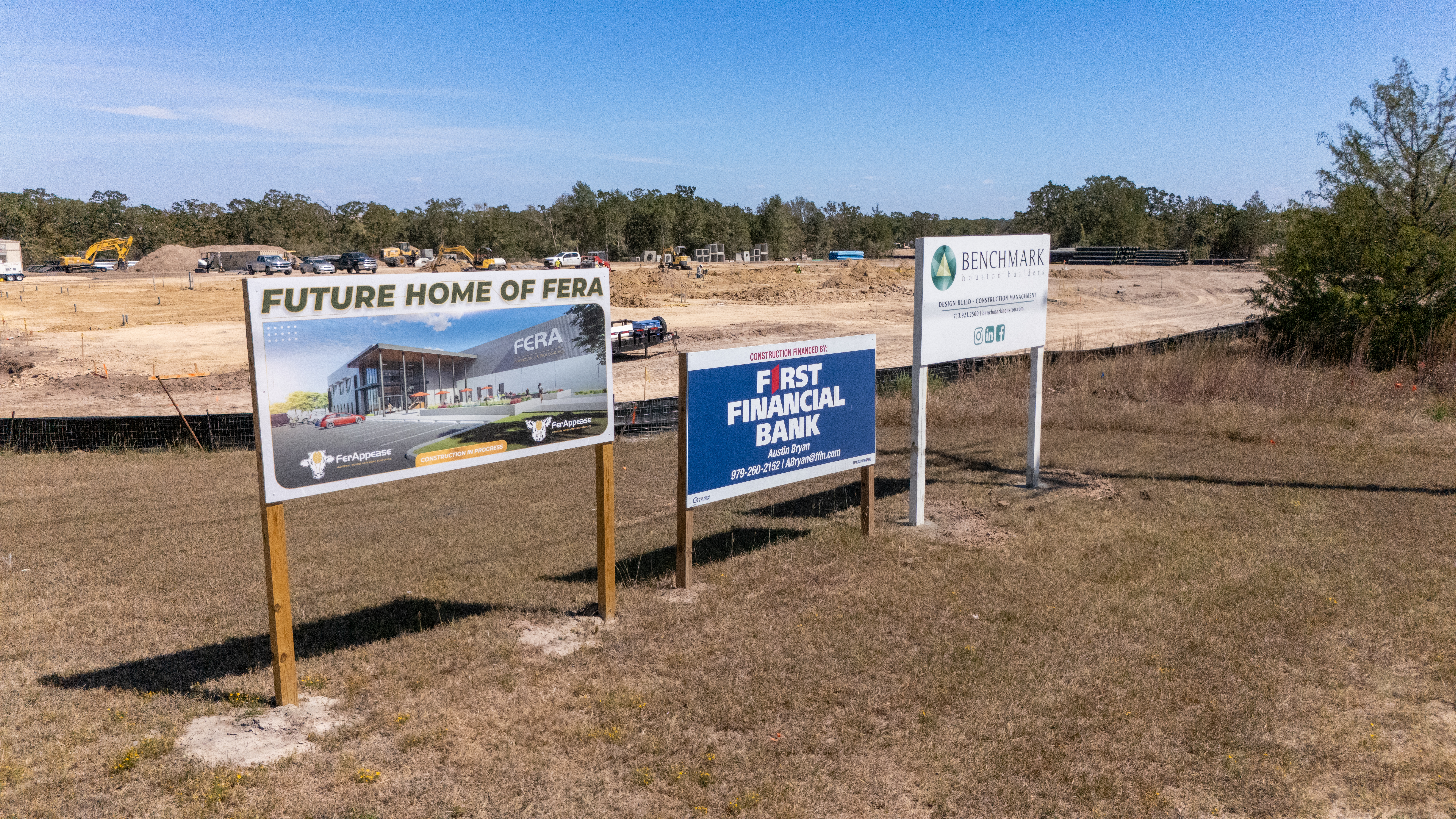 Signs of upcoming projects on land.