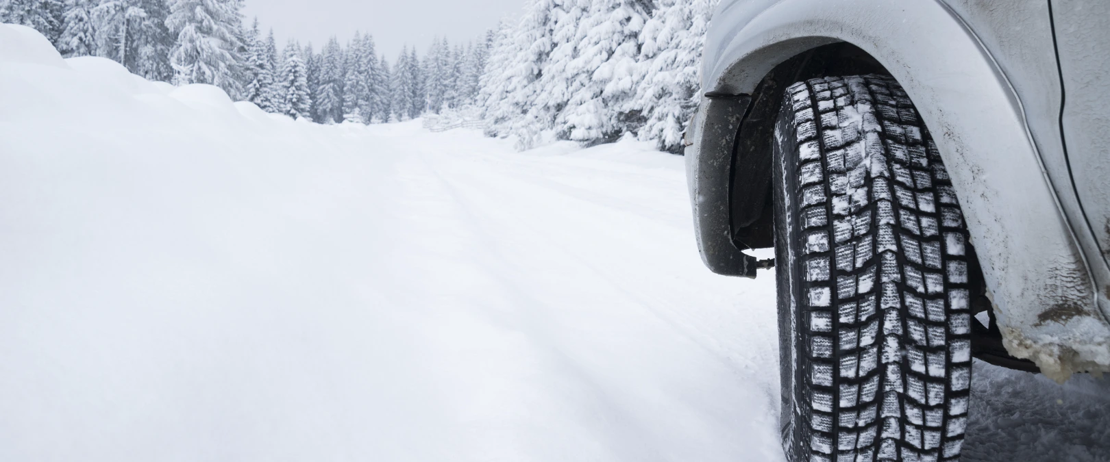 photo of car with snow tires
