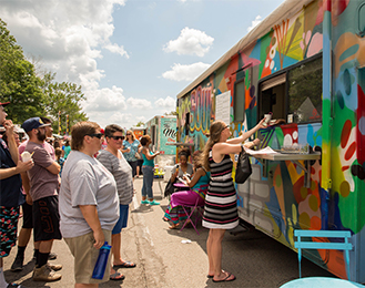 People getting food from a food truck at the Celebrate Meridian Festival