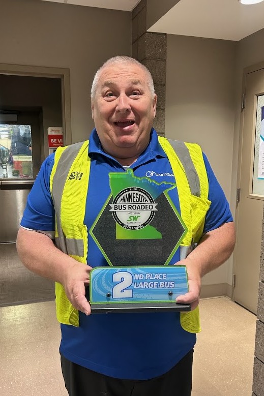 RPT driver holding 2nd place trophy.