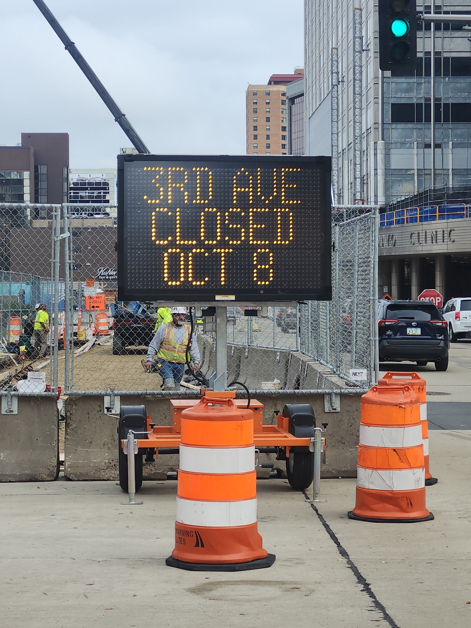 Construction information board saying 3 Ave SW closes Oct 8